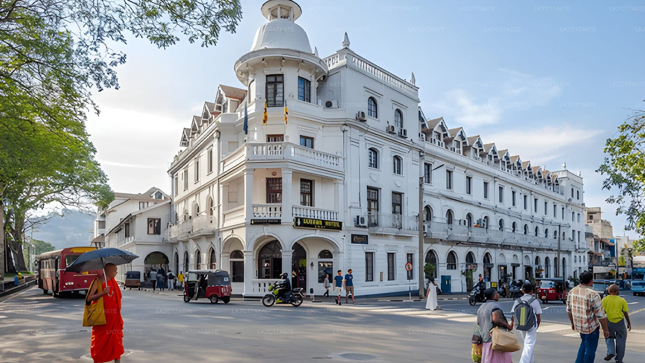 Historic white building with people around in a city street